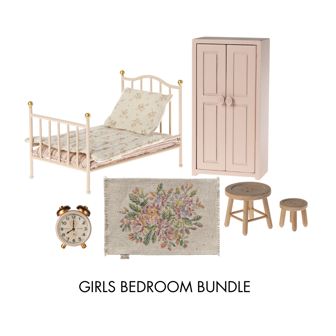 Maileg sister girls bedroom dollshouse bundle, with a Maileg rose bed, pink wardrobe, floral rug, table and stools and Maileg alarm clock