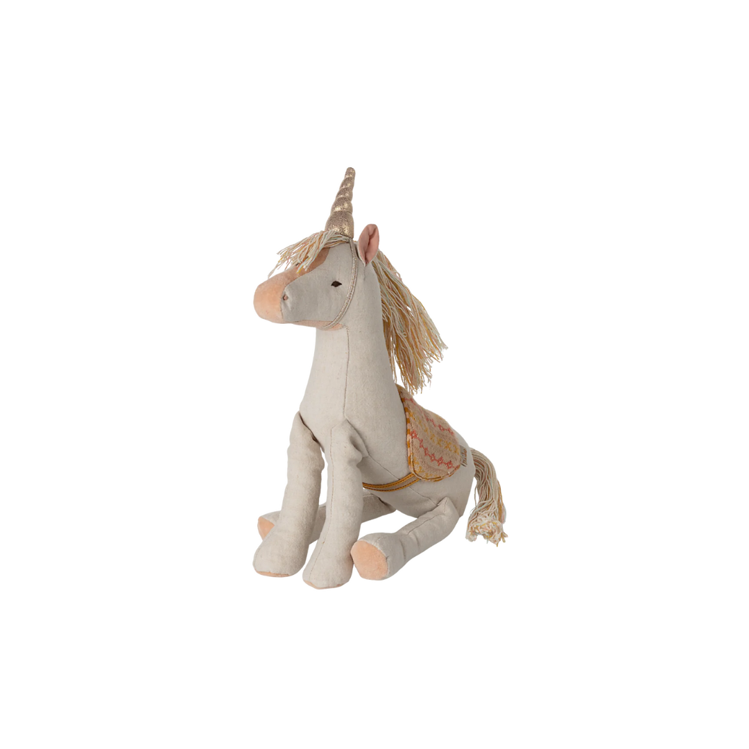 Maileg medium unicorn soft toy, pretty pink toy for children with patterned saddle and unicorn shimmering horn, from Maileg SS25 collection. Unicorn toy sitting